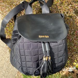 Calvin Klein Black Back Pack with Adjustable Straps and Carrier Handle.